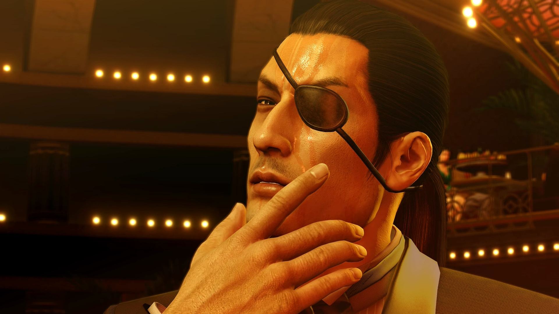 A young, sweaty Goro Majima stroking his chin in Yakuza 0. 